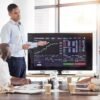 Business people, stock market dashboard on screen and coach for trading, finance presentation and g